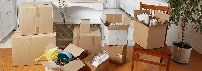 Packed moving boxes and household items in a kitchen before move-out or move-in cleaning, Memphis, TN.